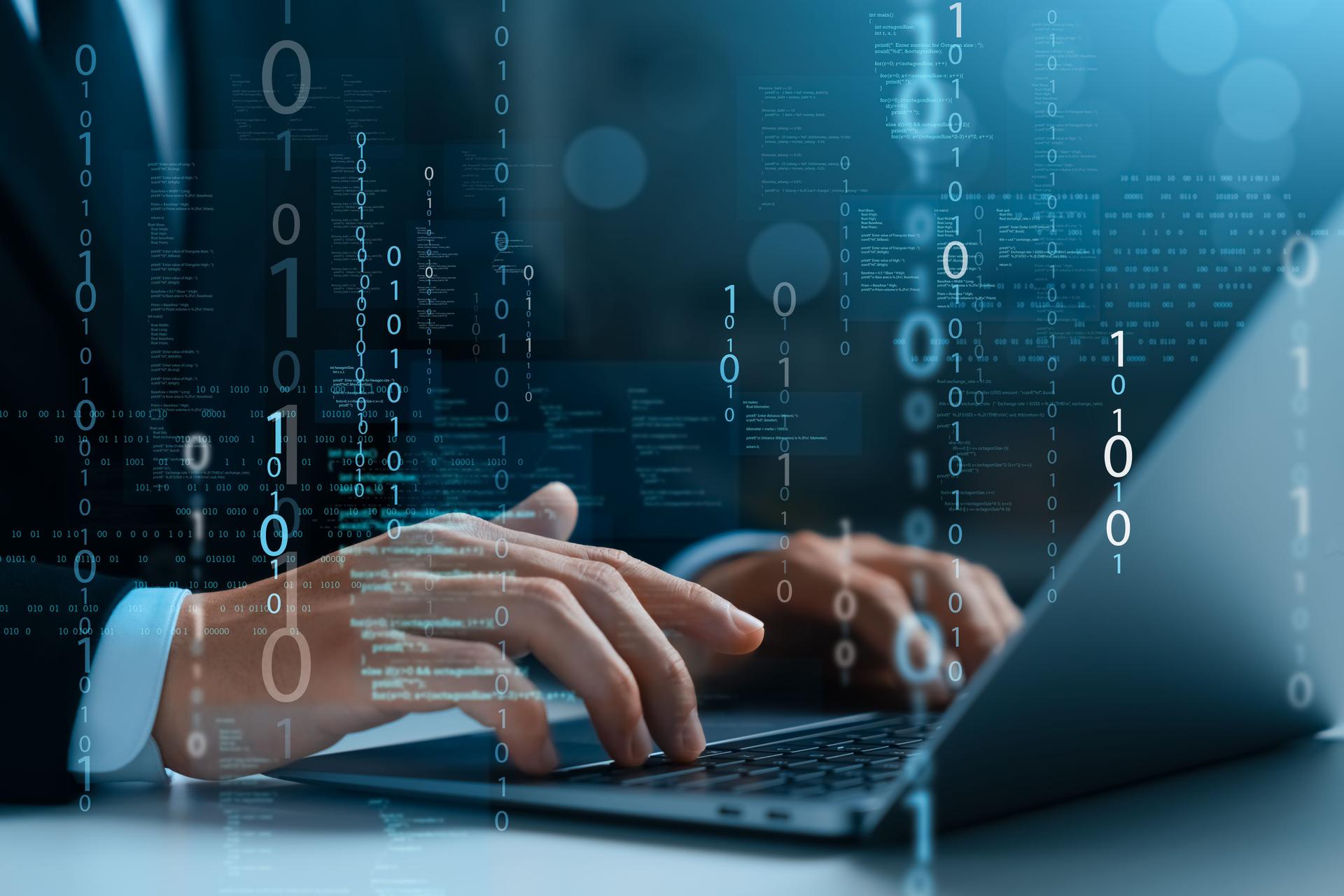 Programmer and cyber security technology, male programmer uses laptop for software coding.